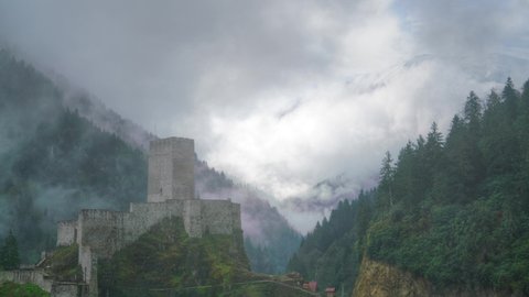 8K 7680X4320.Medieval Castle and watchtower in valley.Time lapse clouds.Pine forest mountain historical building historic damp fog moist Camlihemsin Rize Turkey.Nature 4320p restored small little 8K.