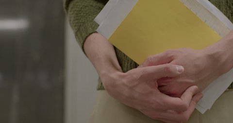 Checking personal correspondence of KGB employees. They are examining the documents in their hands. Close-up of the hands, looking for the prisoner's letter.
