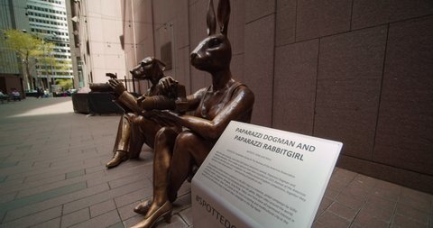 New York, New York United States - May 5,  2022: Paparazzi Dogman and Paparazzi Rabbitwoman (Bronze Sculpture). Plaque honoring Paparazzi in the city.