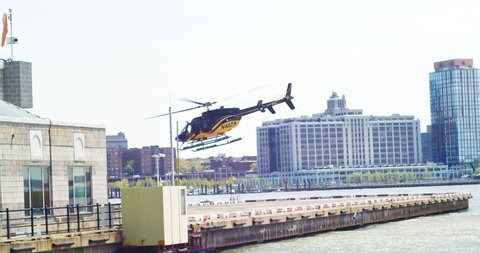 New York, New York United States - May 5,  2022: Helicopter takes off from East River Heliport in downtown manhattan.