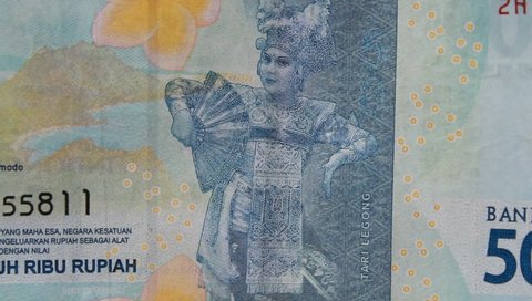Fifty thousand rupiah banknote, details of rotating Indonesian banknotes on a white background, finance concept, bank of indonesia, economy, market and invesment, money - Indonesia 14 may 2022