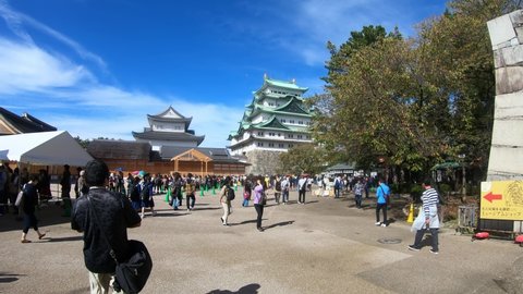 Nagoya, Japan - October 20, 2019: Slow motion video of tourists in the Honmaru area in front of main keep of Nagoya castle. Nagoya. Japan