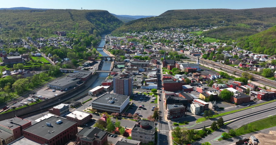 High aerial of downtown Cumberland Maryland. Truck shot in daytime.