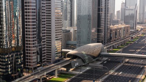 Dubai, United Arab Emirates - October 22 2021: Traffic on Sheikh Zayed Road and Dubai Metro at Financial Centre Metro Station