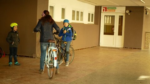 OLOMOUC, CZECH REPUBLIC, MARCH 25, 2022: Refugees rooms hostel accommodation flat apartments Ukraine children family mother people bicycle cycling Center Help Ukraine, asylum humanitarian service
