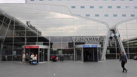 Eindhoven, Netherlands 5 May 2022 :  People walking out Eindhoven airport terminal building