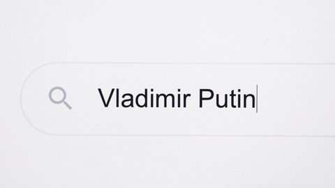 Kyiv, Ukraine April 19 2022: Close Up of searching for Vladimir Putin on the Internet. Russian Federation attacked Ukraine. Animated headline of typing text Vladimir Putin in 4k UHD.