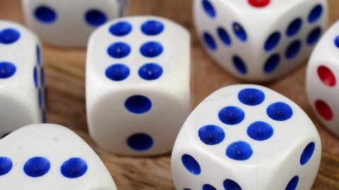 Many gambling dice cubes gamling at casino test your luck, realm of random, rotate slowly.