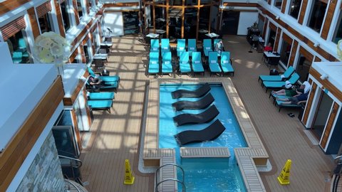 Orlando, FL USA - January 8, 2022: The Haven Pool on the Norwegian Cruise Lines Escape cruise ship in Port Canaveral, Florida.