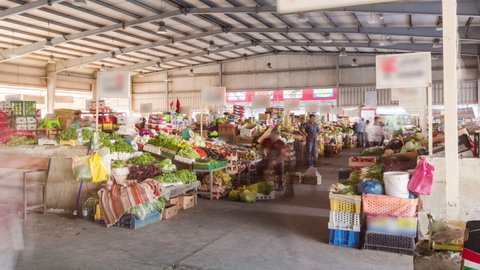 Fruit market in the emirate of Ajman timelapse with people selling fruits and vegetables. United Arab Emirates