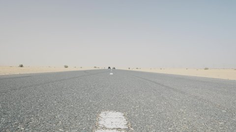 Dubai, OAE 24.04.22 : Rolls-Royce Cullinan and Drawn driving across the desert in a race.