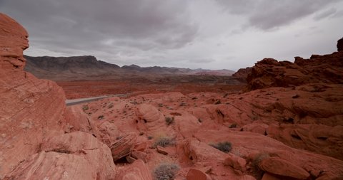 Red rocks in the Valley of Fire State Park, Nevada with dark stormy clouds moving across the landscape in a 4K time-lapse 