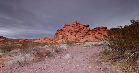 Red Rocks making the landscape of Valley of Fire State Park, Nevada with dark stormy clouds moving across the landscape 