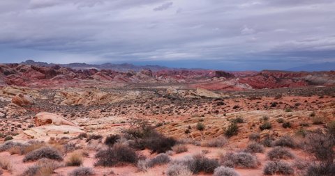 4K time lapse in Valley of Fire State Park, Nevada with storm clouds moving across the red rock landscape. view from the Rainbow vista trail head 
