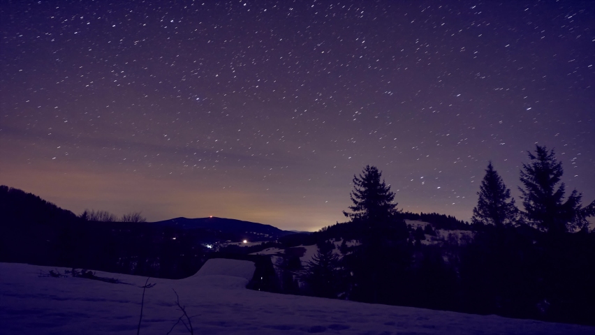 Night sky with stars in winter landscape in the forest. Shooting stars,Stars, long lines, meteorites | Shutterstock HD Video #1090233959