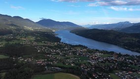 Rainbow over Millstatter see in Austria, in the Dolomites. Aerial video of the lake and houses near it, the calm atmosphere of the Austrian hinterland
