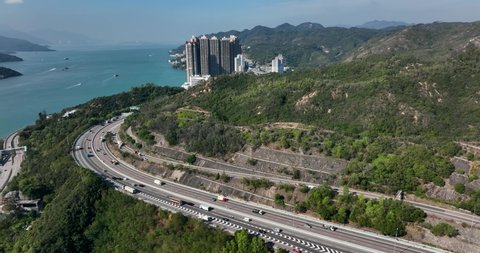 Tuen mun, Hong Kong 20 January 2022: Drone fly over Hong Kong highway beside mountain and sea