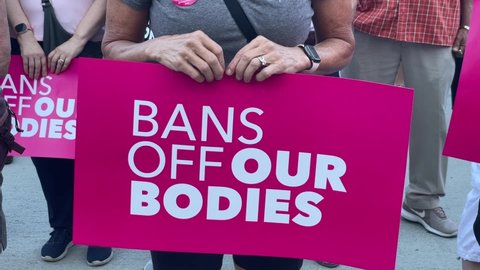 Abortion-rights protesters holding signs take part in the "Bans Off Our Bodies Abortion Rally"  on Saturday, May 14, 2022 in Pasadena, California. Video Stok Editorial