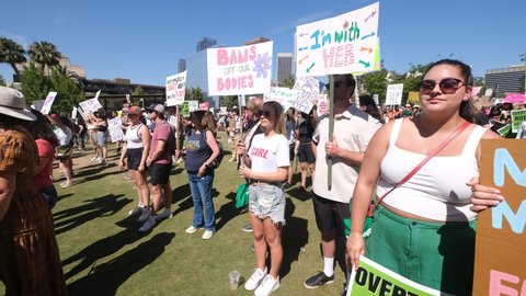 Abortion-rights protesters holding signs take part in the "Bans Off Our Bodies Abortion Rally"  on Saturday, May 14, 2022 in Los Angeles. Video Stok Editorial