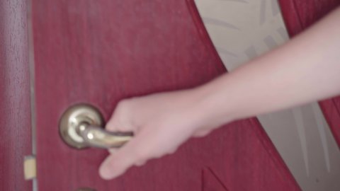 Man hand opening and close wooden door in room by doorhandle or doorknob. Holding door handle. Mans opens and closes a door. Person opens the door. High quality 4k footage