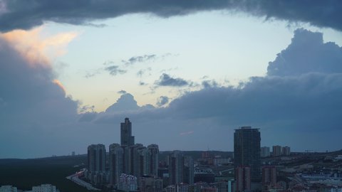 8K 7680X4320.Transition from day to night in the large city.Downtown time lapse lights.Sunlight disappears illuminate the streets.Crowded metropolis sky.Cloudscape modern house sunset cloudy cloud.8K.