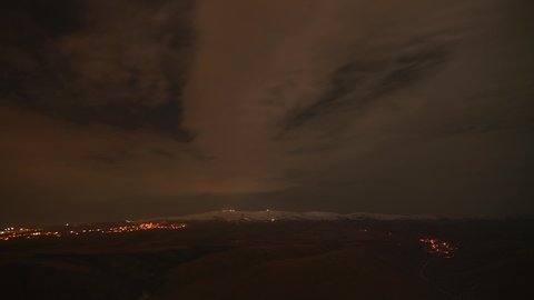 8K 7680X4320 4320p.Transition from cloudy dark night to sunrise.Lights of tv transmitter antennas on mountain top.Peak summit ridge nature landscape sunrise sunup at dawn twilight early morning day 8K