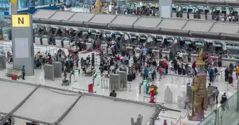 March 23,2022 : Bangkok, Thailand : Timelapse inside the airport departure terminal  Suvannabhumi Airport with many passenger while opening country