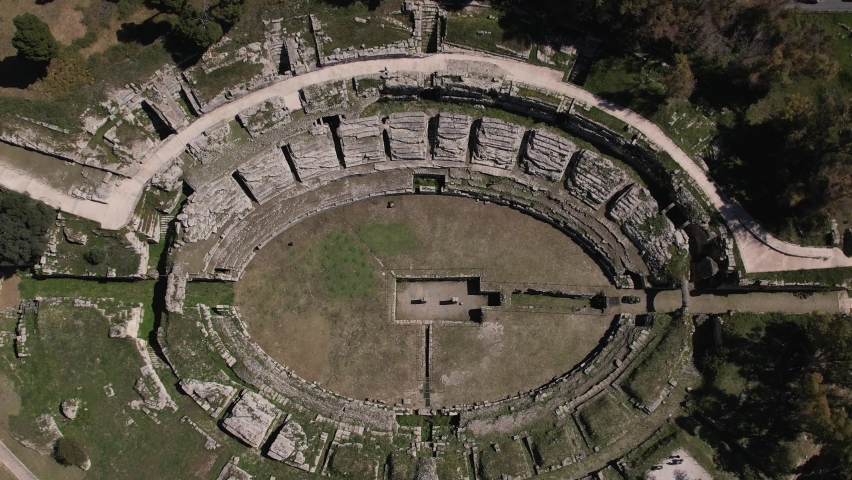 The Greek Theater of Syracuse is located on the southern slopes of Temenite Hill, overlooking the modern city of Syracuse in southeast Sicily.
