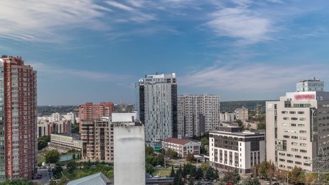 Kharkiv city panorama from above during all day timelapse from morning to evening. Aerial view of residential districts near botanical garden metro station. Ukraine.