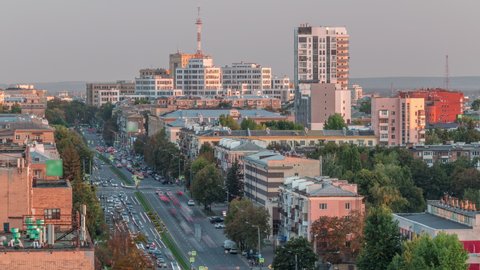 Kharkiv city panorama from above before sunset timelapse. Aerial view to city center and avenue of science from residential districts near botanical garden metro station. Ukraine.