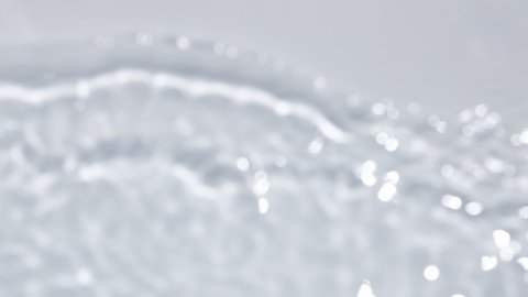 Close up view on Water texture with waves on the water overlay effect for video mockup. Organic light gray drop shadow caustic effect with wave refraction of light. Slow motion full HD video banner.