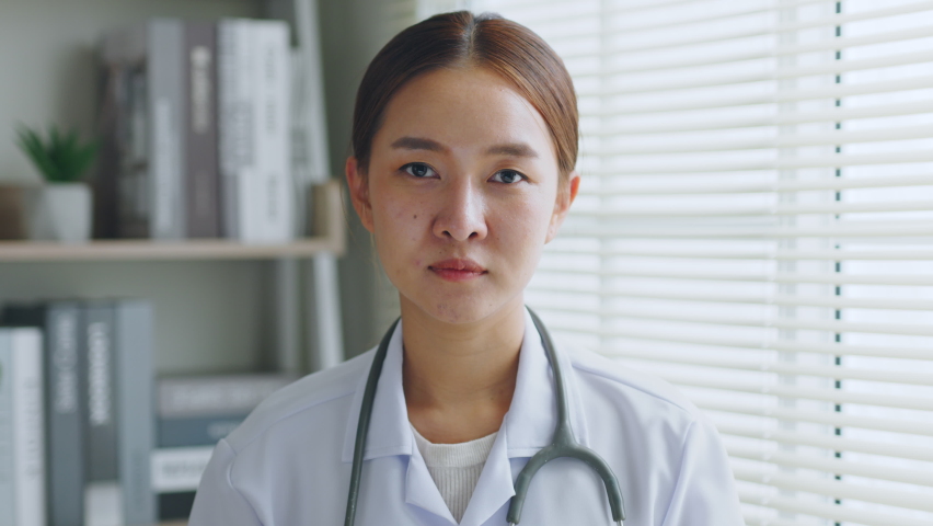 POV Asian woman doctor making online live streaming broadcast talking over camera recording in hospital, medical and healthcare blogger, vlogger concept Royalty-Free Stock Footage #1090257569