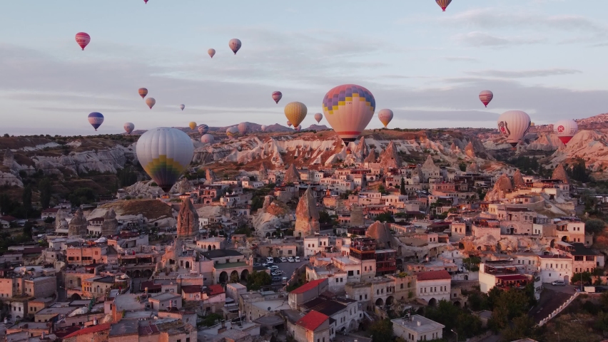 hot air balloons fly in Cappadocia, shooting from a drone in 4k Royalty-Free Stock Footage #1090259381