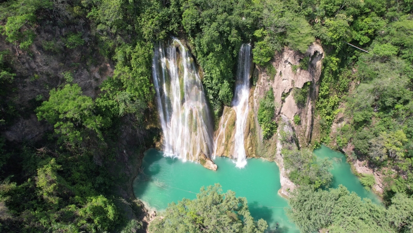 The fantastic view of Minas Viejas cascades in San Luis Potosi, Huasteca Potosina, México. 
An amazing waterfall with turquoise water. One of the best waterfalls in Mexico Royalty-Free Stock Footage #1090261201