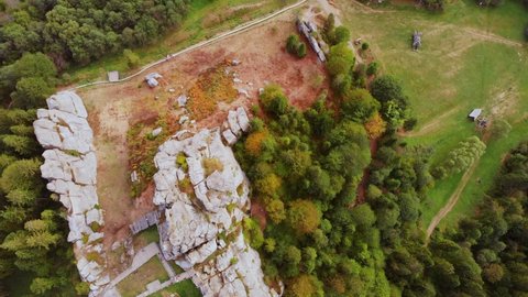 Aerial drone view of famous Tustan fortress. Ukrainian medieval cliff-side monument in national park. Rock complex of Tustan is popular tourist landmark in Carpathians mountains. Ukraine, Lviv oblast