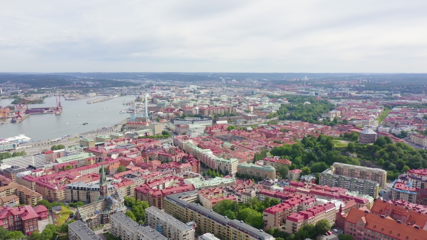 Inscription on video. Gothenburg, Sweden. Panorama of the city and the river Goeta Elv. The historical center of the city. Cloudy weather. Name is burning, Aerial View