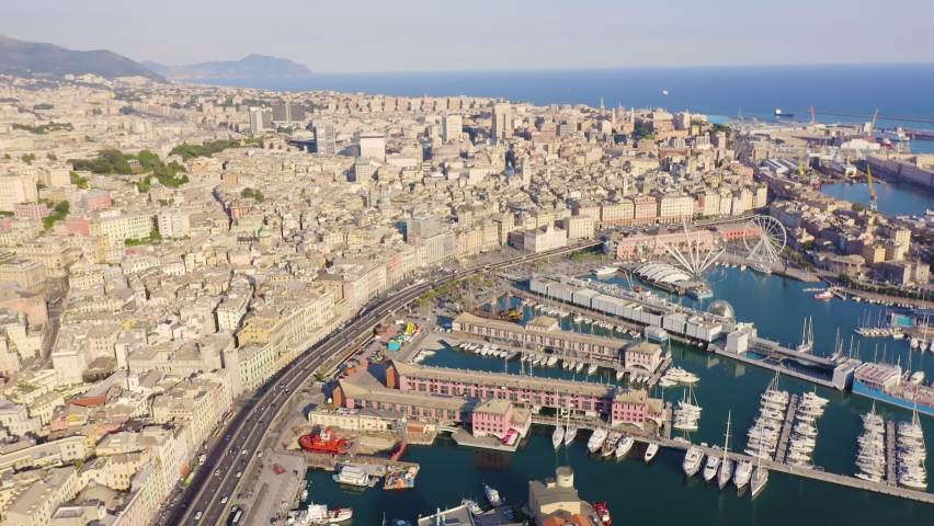 Inscription on video. Genoa, Italy. Central part of the city, aerial view. Ships in the port. Neon white effect text, Aerial View