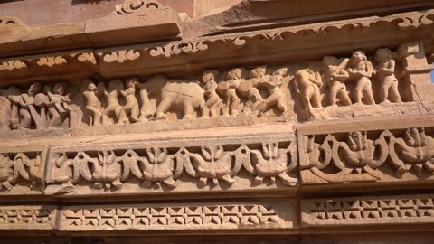 Panels of erotic Sculptures of loving couples, mythical figures on outer walls, Khajuraho Temple, UNESCO World Heritage Site, Madhya Pradesh, India