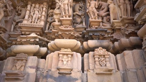 Panels of erotic Sculptures of loving couples, mythical figures on outer walls, Khajuraho Temple, UNESCO World Heritage Site, Madhya Pradesh, India