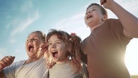 group of kids team hugging a jumping and rejoicing outdoors. happy family teamwork kid dream concept. family children sisters sun brothers have fun hugging in the park in nature - Powered by Shutterstock - Get 15% off with code: PIKWIZARD15