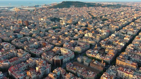 Aerial view of Barcelona city skyline with morning light. Catalonia, Spain. Cityscape with typical urban octagon blocks