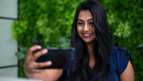 Attractive Asian Woman Taking Selfie On Mobile Phone
