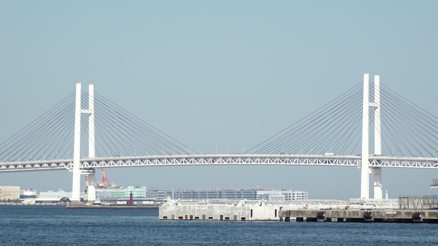 YOKOHAMA, KANAGAWA, JAPAN - APRIL 2022 : View of Yokohama Bay Bridge in daytime. It crosses Tokyo Bay with a span of 460 meters.