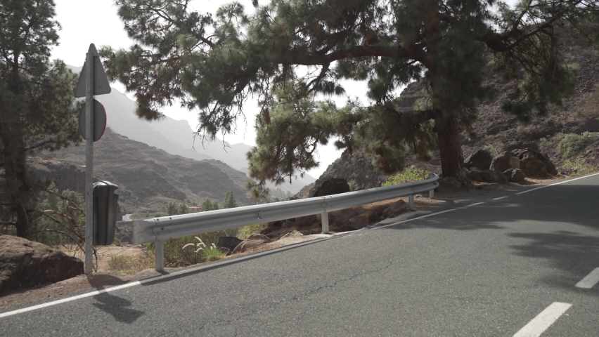 Cyclists on road through mountains near Barranco de Mogan, Gran Canaria, Canary Islands, Spain, Atlantic, Europe
