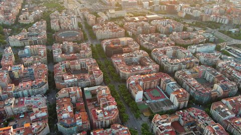 Barcelona aerial view of the residential Eixample district. Catalonia, Spain. Famous urban grid in Beautiful Sunlight with Urban Traffic