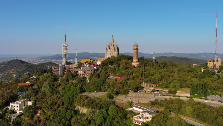 Aerial view of Barcelona skyline with Sagrat Cor temple during a sunny day, Catalonia, Spain