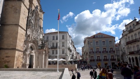 Coimbra, Portugal - May 01 2022: Coimbra Portugal City Center Santa Cruz Market with Portugal National Flag