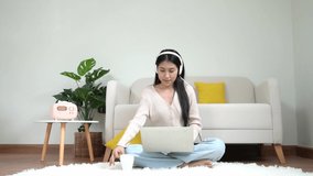 Young smiling woman working and meeting in living room.  Lifestyle girl using laptop for entertainment and relax chill after conference call.  Lifestyle Concept 