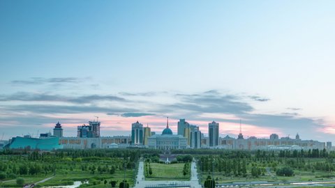 Panorama of the Astana city day to night transition timelapse and the president's residence Akorda with park. View from the Palace of Peace and Reconciliation. Nur-Sultan city, Kazakhstan