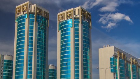 New business district timelapse hyperlapse with traffic on road and green modern towers in the capital of Kazakhstan in Astana. Nur-Sultan city